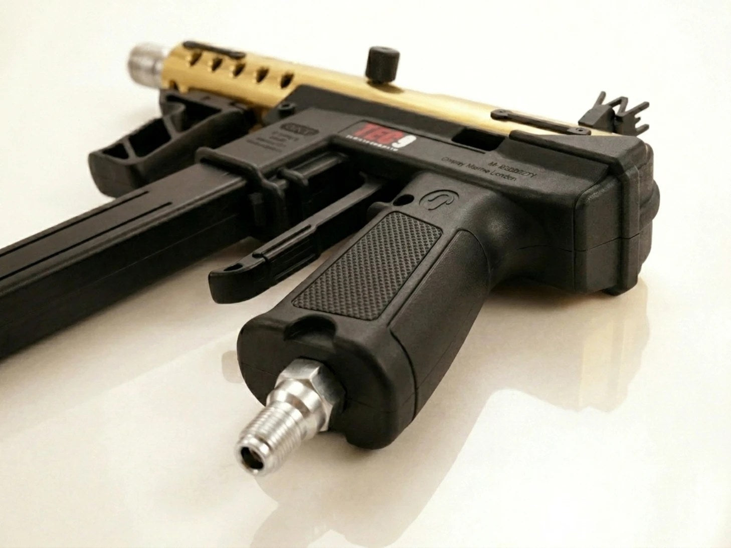 Rear grip and hose fitting